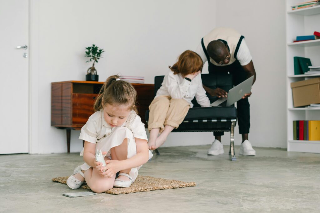 Young girl engaged in play therapy with psychologist's guidance indoors.